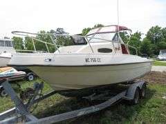 1992  KEY WEST 20 foot with CUDDY CABIN, with electronics, portable toilet, accessories, with 175 HP MARINER Outboard Motor, Hull ID  KWEWA189E292, with EZ LOADER Galvanized Trailer