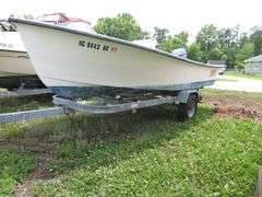ATLANTIC 18 foot Center Console Fiberglass Boat with motor well, 70 hp EVINRUDE OUTBOARD Motor & LONG galvanized boat trailer, Boat Hull ID ATNOO868G585