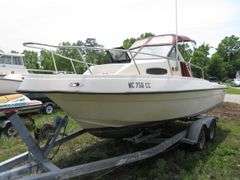 1992  KEY WEST 20 foot with CUDDY CABIN, with electronics, portable toilet, accessories, with 175 HP MARINER Outboard Motor, Hull ID  KWEWA189E292, with EZ LOADER Galvanized Trailer
