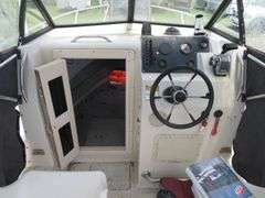 1992  KEY WEST 20 foot with CUDDY CABIN, with electronics, portable toilet, accessories, with 175 HP MARINER Outboard Motor, Hull ID  KWEWA189E292, with EZ LOADER Galvanized Trailer