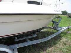 1992  KEY WEST 20 foot with CUDDY CABIN, with electronics, portable toilet, accessories, with 175 HP MARINER Outboard Motor, Hull ID  KWEWA189E292, with EZ LOADER Galvanized Trailer