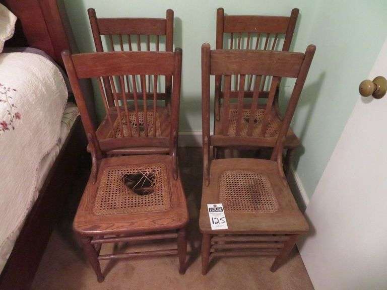 Four nice cane bottom dining chairs, 3 identical, 1 mixed matched image