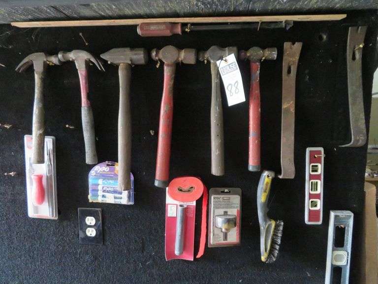 Six hammers, two levels, two flat bars 2 1/2" hole saw image