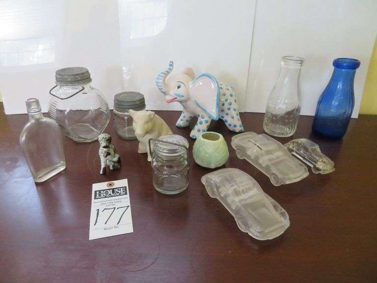 Assorted glass decorative items, piggy banks, bottles image