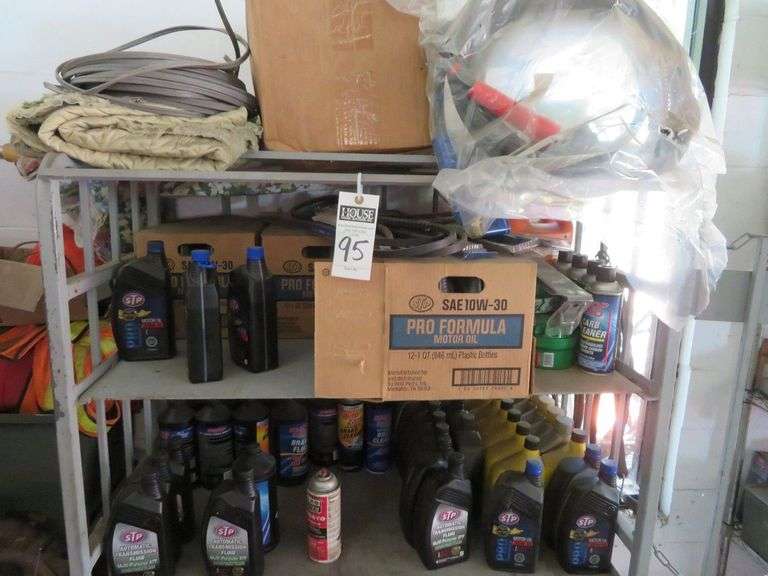 Large Shelf Unit with large quantities of various automotive fluid, shelf sells with lot image