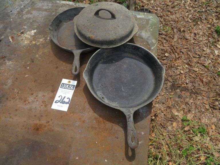(1) 9" cast iron frying pan, (1) 8" cast iron frying pan with cast iron lid image