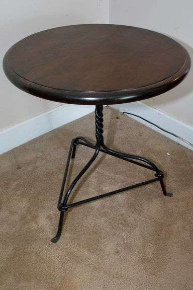 Wooden Table with solid iron legs, circular, approx. 26"H x 25" image