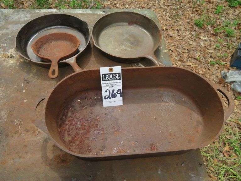 One Oval deep cast iron Deep Fish Fryer, 12" long x 8", (3) cast iron frying pans, (2) 8" frying pans and (1) 5" pan image