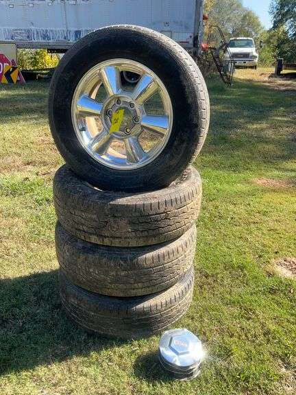 Lot - (4) GMC General Tires 245/65 R17 with Chrome Rims and Hubcaps image