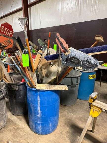 Bin with Mops, Shovels, Poles image