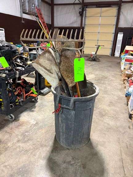 Trash Bin with Shovels, Rake and Tools image