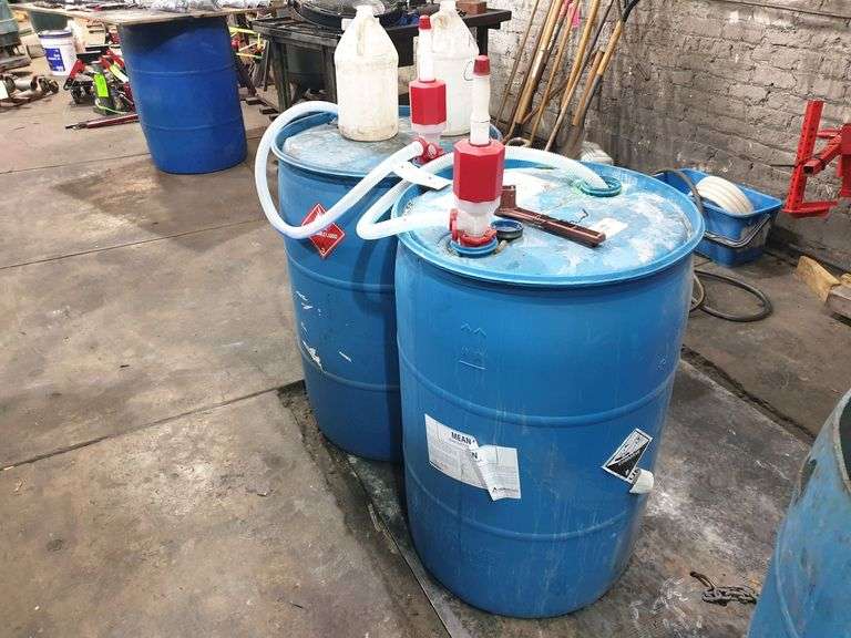 (2) Mostly empty barrels.  (1) has small amount of "mean green) and (1) has a small amount of window wash fluid image