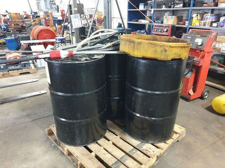 (3) Empty 55-gal drums and (1) 110 V Electric OIL Pump image