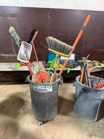 Trash Bin with Brooms and Signs image