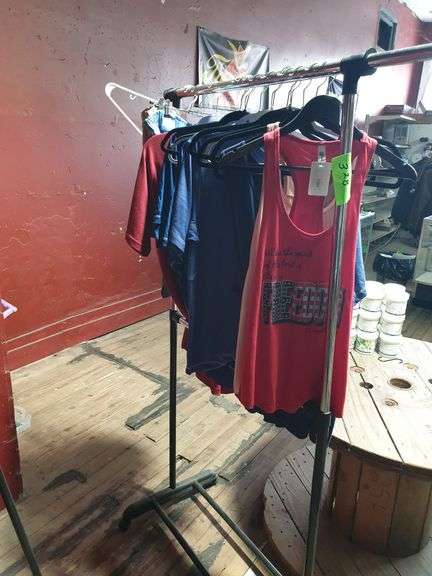 Clothes hanging on rack - metal rack included