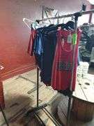 Clothes hanging on rack - metal rack included