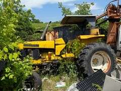 New Holland Tractor with Side Arm Cutter and Alamo Rear Cutter