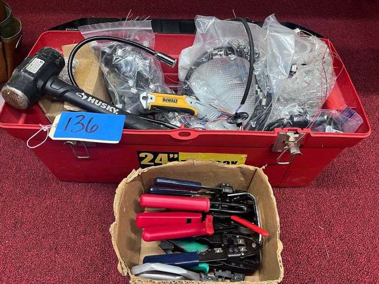 Toolbox with various tools and wire (under table) image