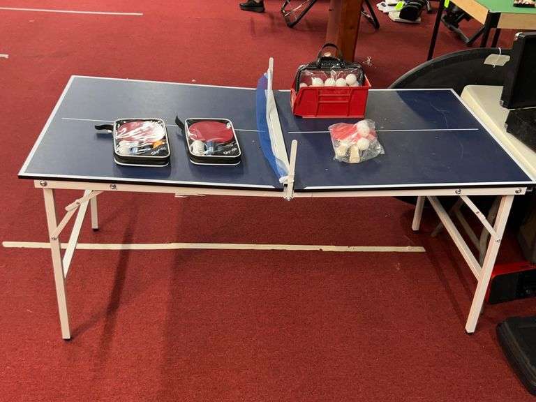 Ping Pong table with paddles image