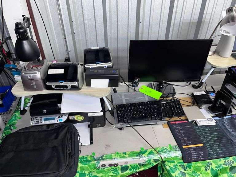Table with all contents: Office Equipment, (2) Printers, (2) label printers/Monitor/Keyboard image