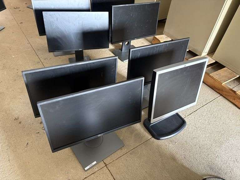 3 Dell Desktop Computer Screens and 1 HP image