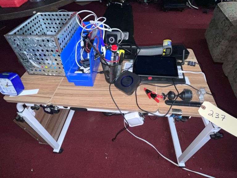 Rolling work table with charging cords/clock infrared Thermometer image