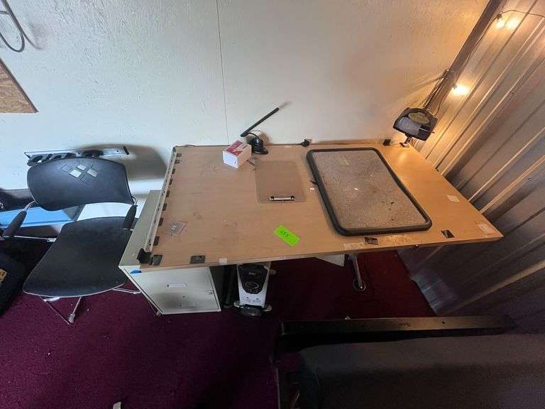 Work table, file cabinet, office chair, portable heater image