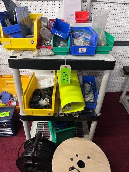 Shelf with Contents:   Misc parts, 1 reel, one spool image