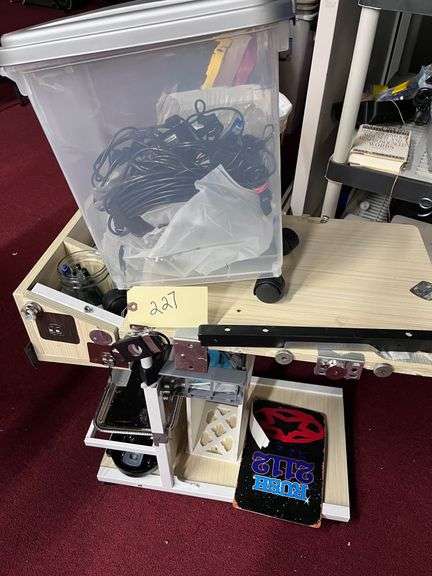 Rolling Cart:   Plastic rolling bin with cords, misc image