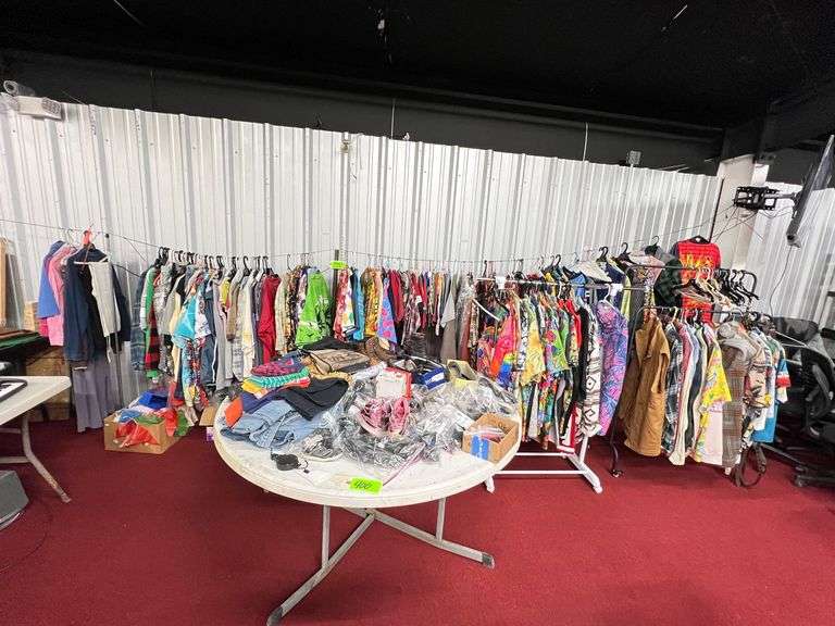 Large Lot:  ALL clothes/ALL shoes, (2) rolling clothes racks and table image
