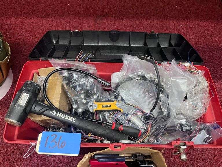 Toolbox with various tools and wire (under table)