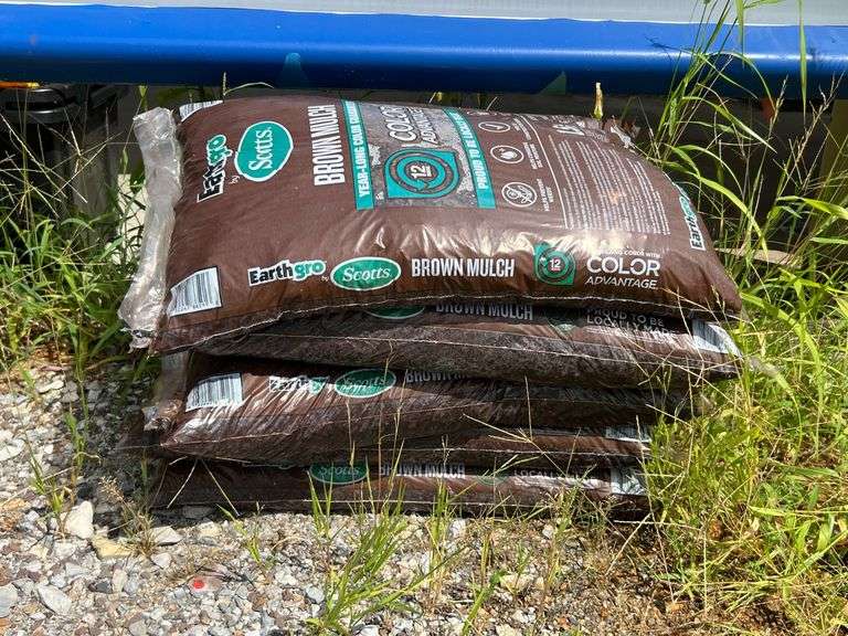 Bins with dirt/top soil/bags of mulch