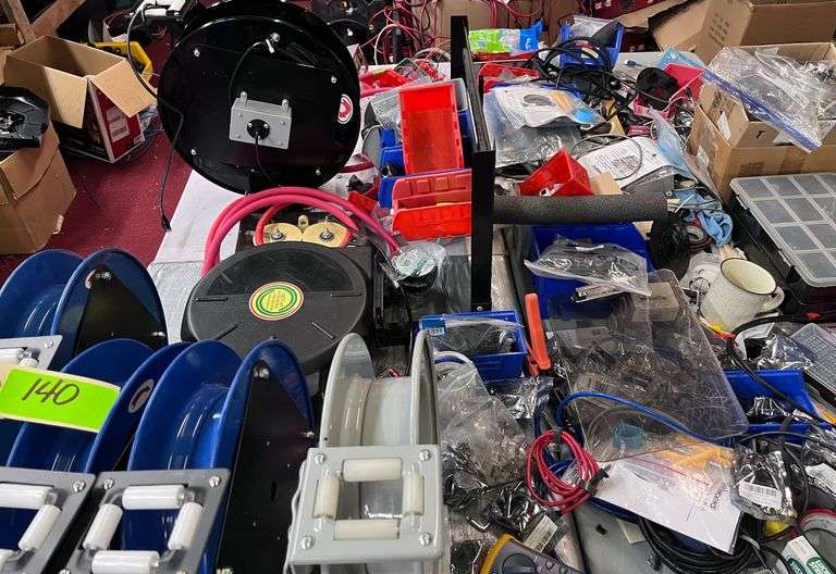 (2) tables with reels with all contents on top & underneath: wire/hoses, etc
