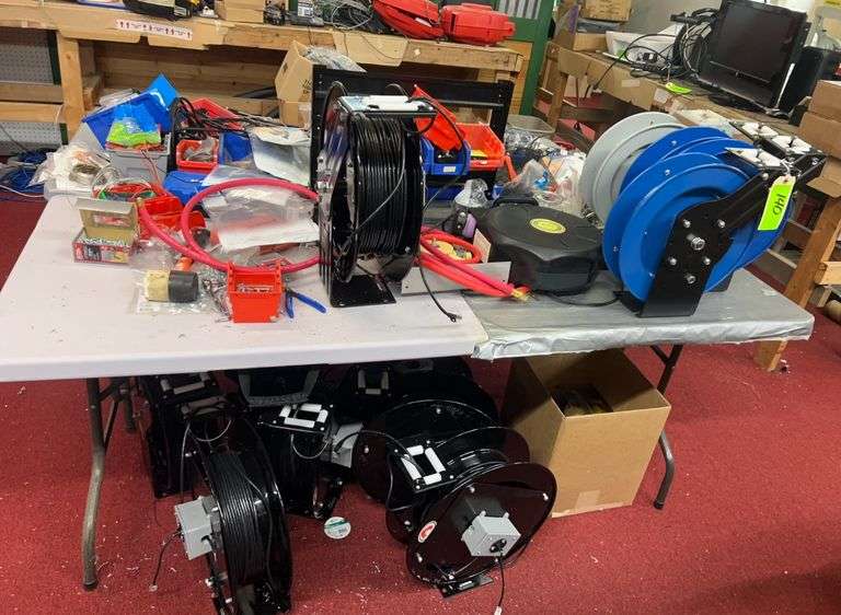 (2) tables with reels with all contents on top & underneath: wire/hoses, etc image
