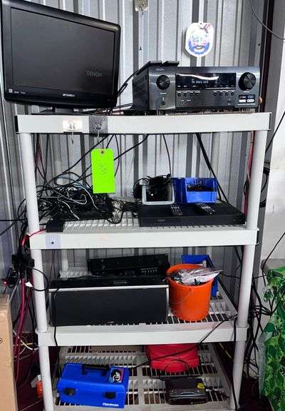 Plastic shelf with all electronic equipment on it image