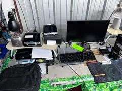 Table with all contents: Office Equipment, (2) Printers, (2) label printers/Monitor/Keyboard