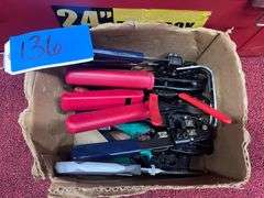 Toolbox with various tools and wire (under table)