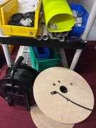 Shelf with Contents:   Misc parts, 1 reel, one spool
