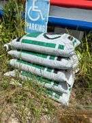 Bins with dirt/top soil/bags of mulch