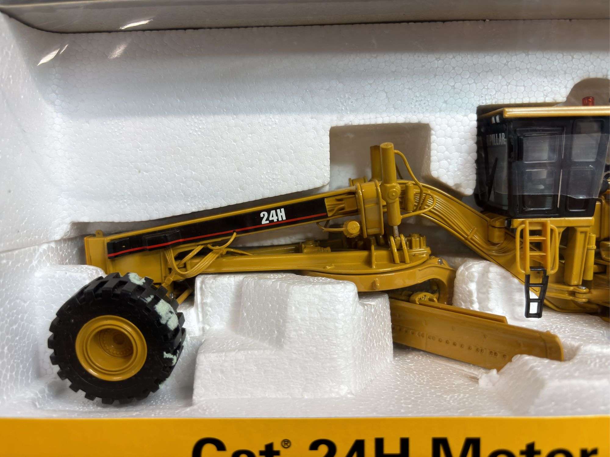 1/50 Caterpillar 24H Grader NIB Norscot - Aumann Auctions, Inc.