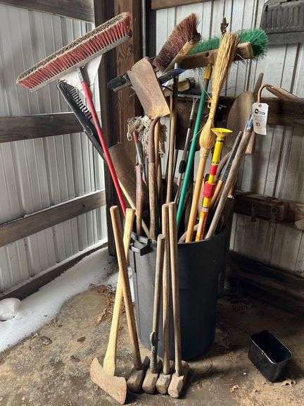 50-Gallon Trash Can of Brooms, Shovels, and More image