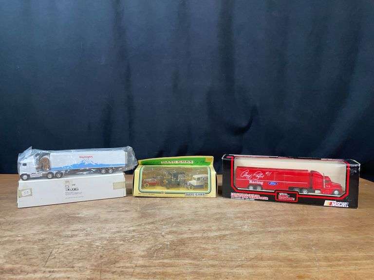 (3) 1/64 Trucks NIB image