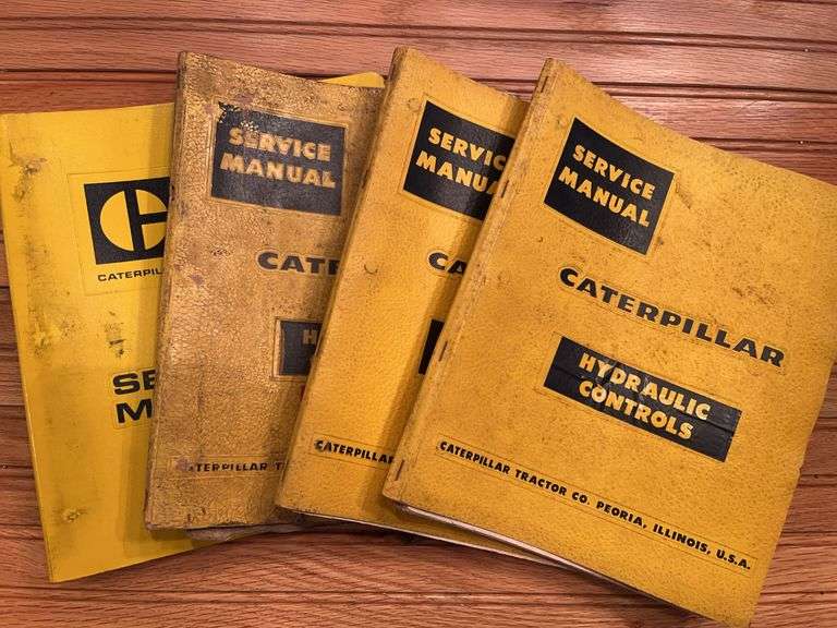 (4) Caterpillar Manuals + Binder image