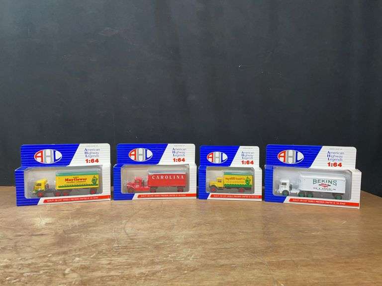 (4) 1/64 Trucks NIB image