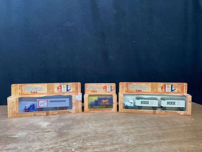 (3) 1/64 Trucks NIB image