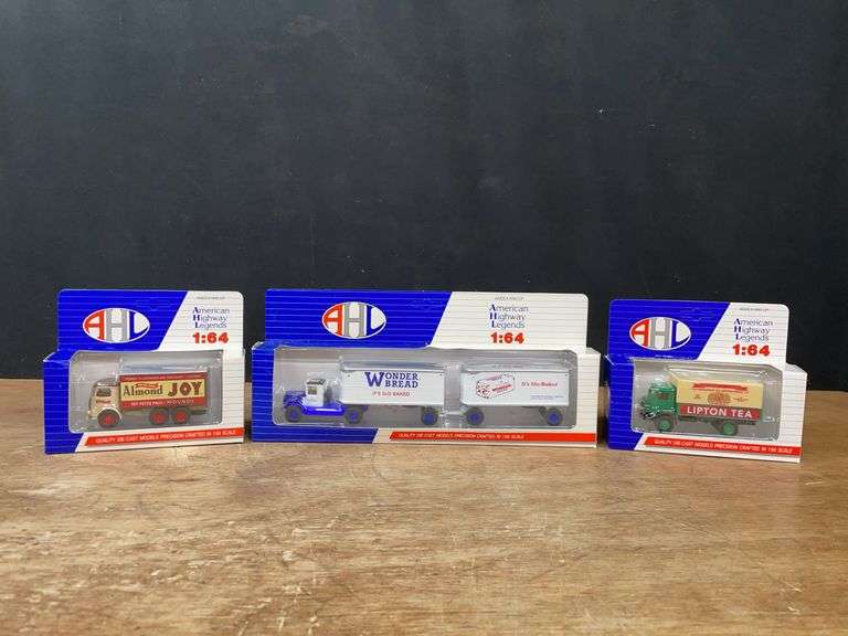 (3) 1/64 Trucks NIB image