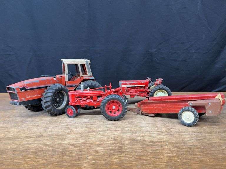 (4) 1/16 IH Tractors + Spreader Ertl image