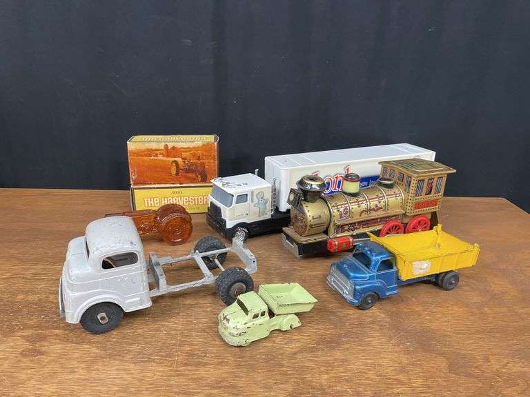 (7) Trucks, Tractors, Train image