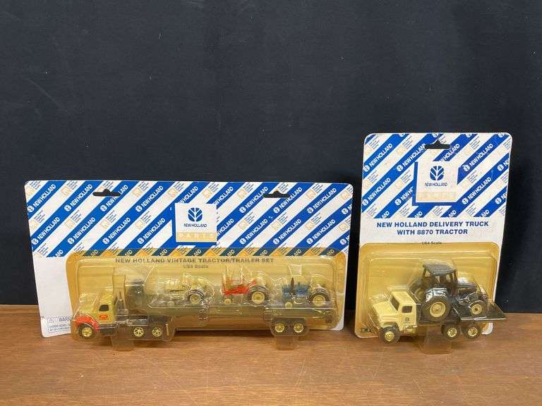 (2) 1/64 New Holland Trucks NIB Ertl image