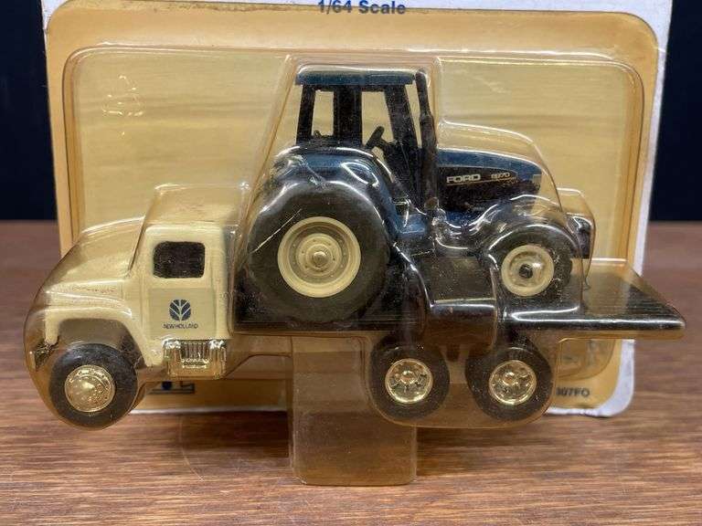 (2) 1/64 New Holland Trucks NIB Ertl